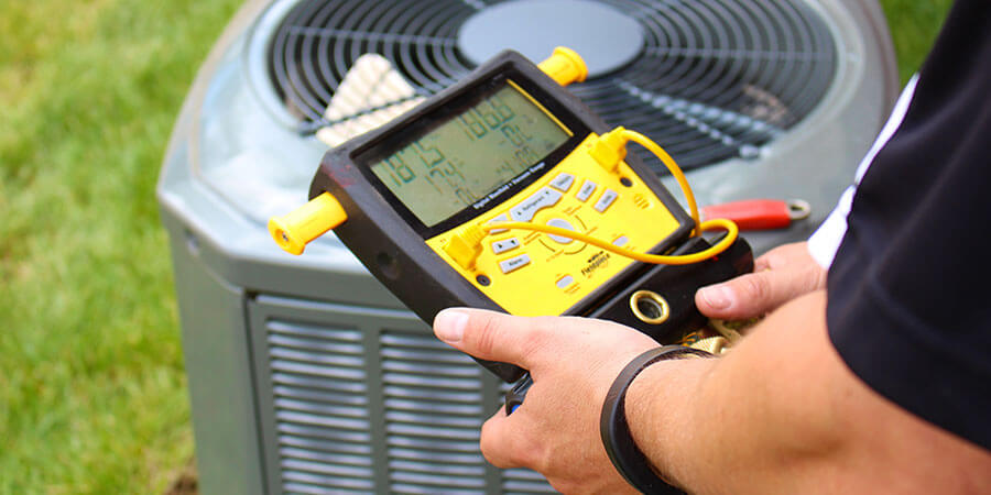 Technician checking AC unit