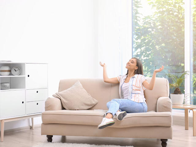 Woman sitting in living room